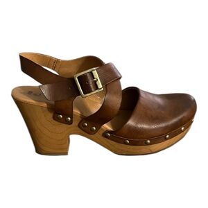 Korks Clog Sandal with ankle wrap strap and brushed gold studs/buckles.